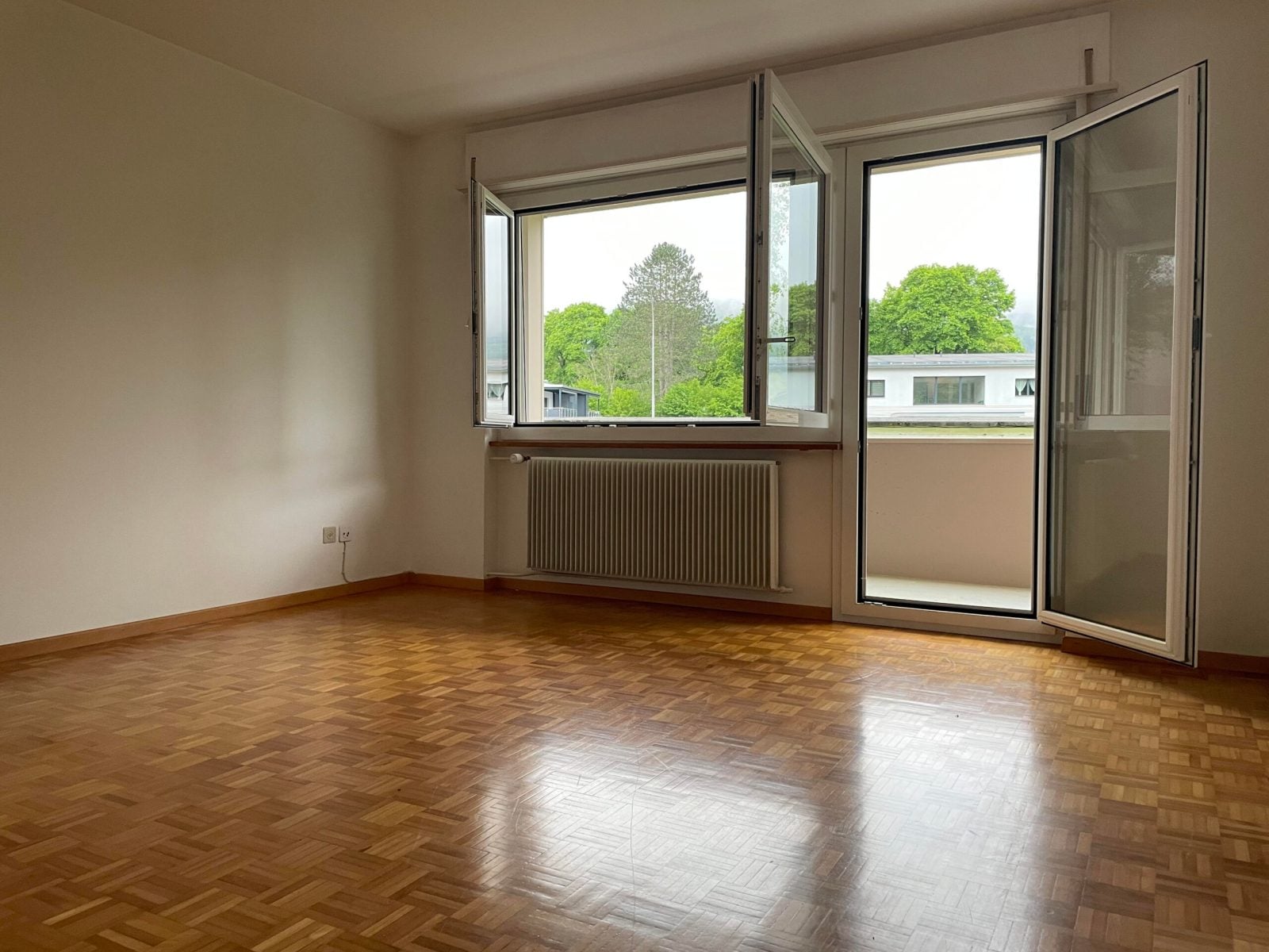 Appartement de 3.5 pièces au rez-de-chaussée - photo 1